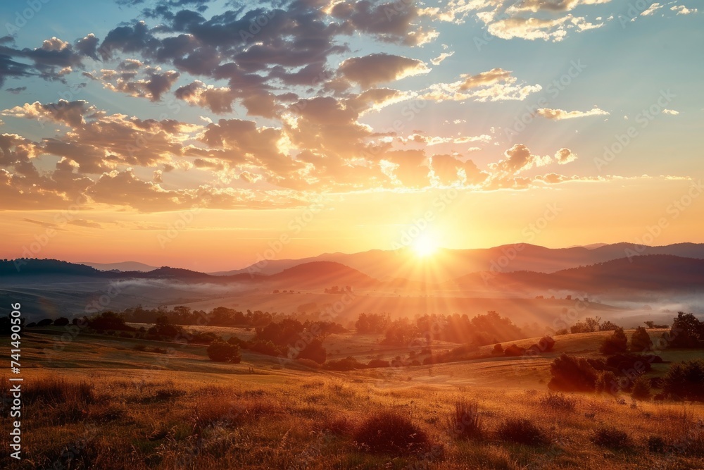 Obraz premium As the sun sets over the ecoregion, the golden afterglow illuminates the rolling hills, painting a tranquil portrait of nature's beauty