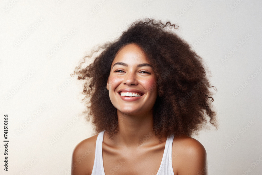 Young adult African American woman posing for beauty portrait. Pretty smiling happy Black girl fashion model smiling on background, attractive ethnic girl looking at camera. Close up face . Young adult African American woman posing for beauty portrait. Pretty smiling happy Black girl fashion model smiling on background, attractive ethnic girl looking at camera. Close up face .
