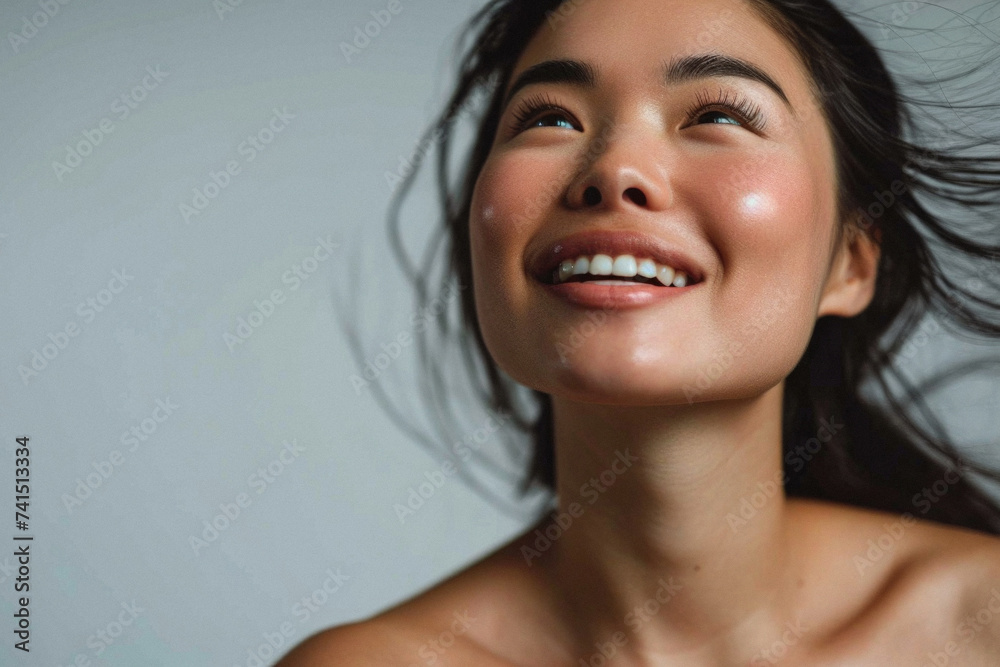 Beautiful confident young adult Asian woman posing for beauty portrait. Pretty smiling happy healthy girl student model from Asia looking at camera smiling on background. Close up face . - obrazy, fototapety, plakaty 