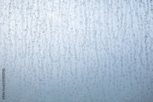 Dried hard water stains on shower window, close up shot, no people