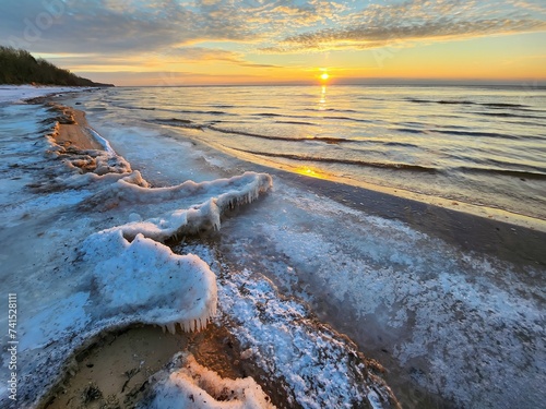 Glorious Winter Morning Frozen Lake Michigan Beach at Sunrise, Icicles in the Sand, Waves at Shore in Soft Morning Light, Natures Tranquility Captured in Stunning Landscape Photography
