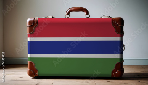 Travel vintage leather suitcase with flag of Gambia photo