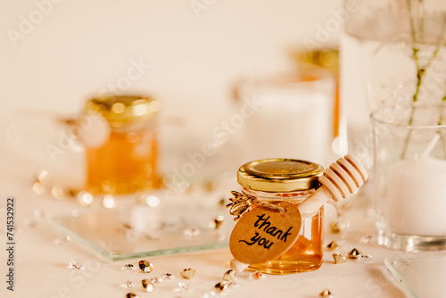 A small jar of honey as a gift at a wedding.