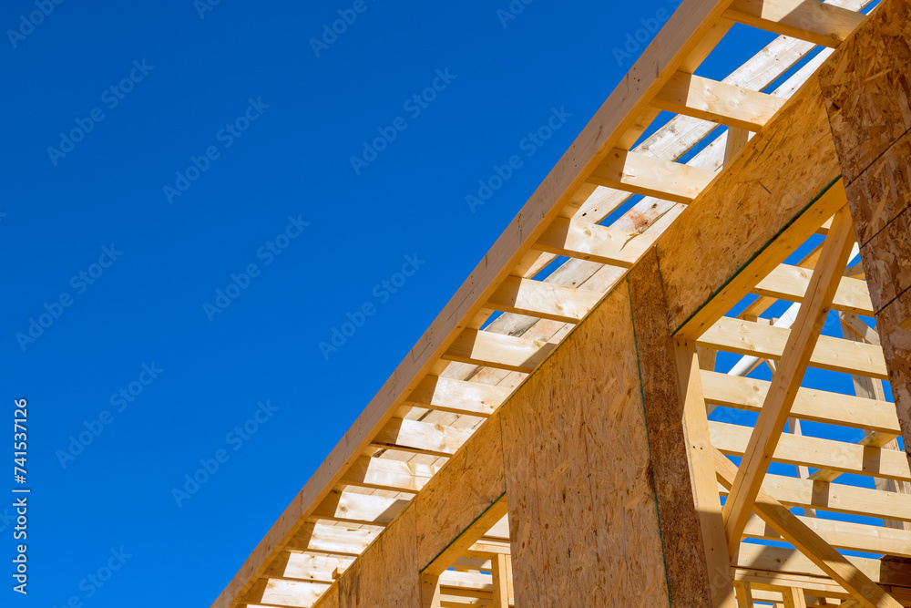 Obraz premium Timber wood stick frame is used to frame beams in newly constructed house