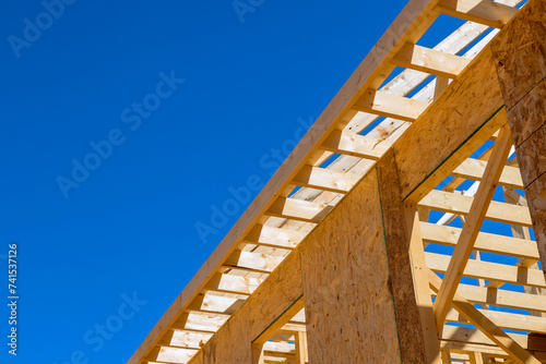 Timber wood stick frame is used to frame beams in newly constructed house
