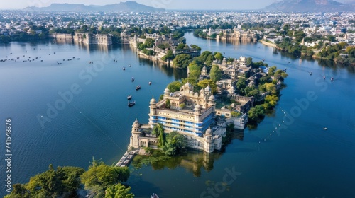 Aerial View of Udaipur City Palace and Lake Pichola. An aerial view showcasing the majestic Udaipur City Palace alongside the serene Lake Pichola, with boats and the cityscape in the backdrop. photo