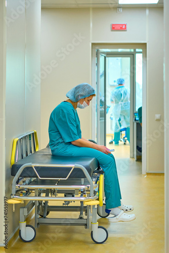 nurse is sitting in the hallway