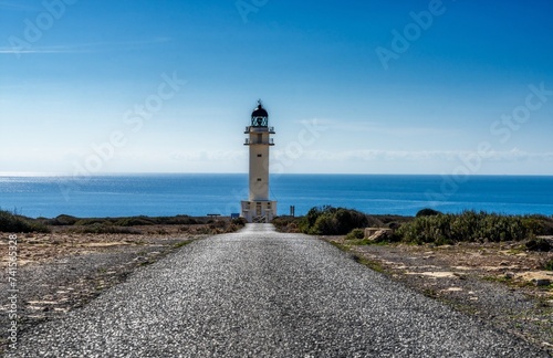 long country road leads to the lighthouse at Cap de Barbaria on Formentera Island photo