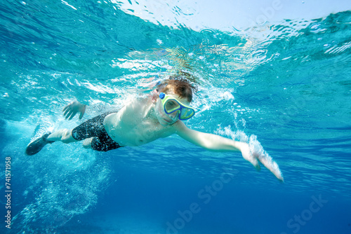 Youth open water swimming in the Caribbean underwater © Andrew Jalbert