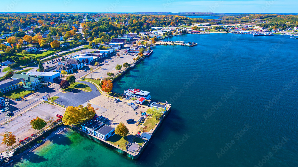 Aerial Autumn Lakeside Town with Boat Dock in Michigan