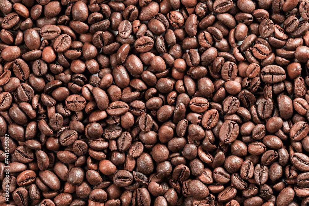 Fototapeta premium Background from coffee grains. Roasted coffee for breakfast. Morning awakening