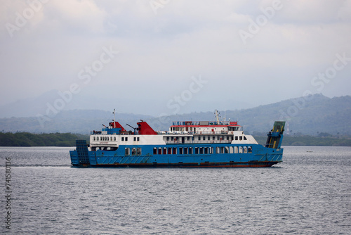 Ferries sail on the sea, ferries in the Bali Strait as a means of transportation between islands in Indonesia. inter-island logistics and economic crossing and shipping modes. photo