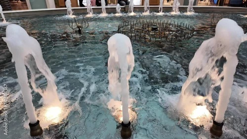 water flowing from pool fountain