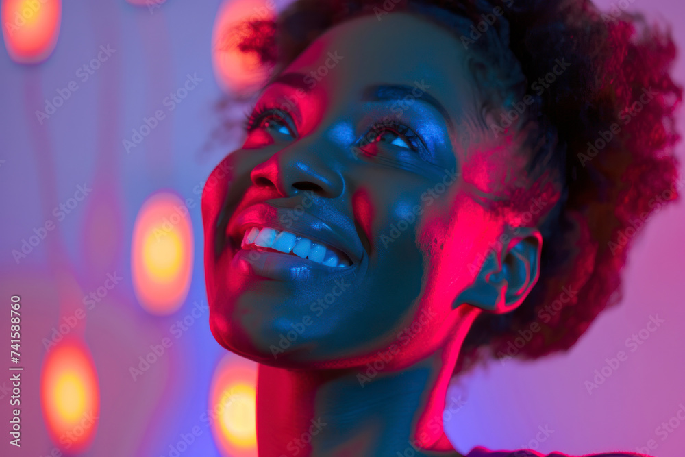 Portrait of african american woman smiling and looking up.