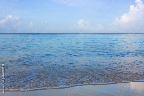 Tropical paradise beach with white sand and blue sky.