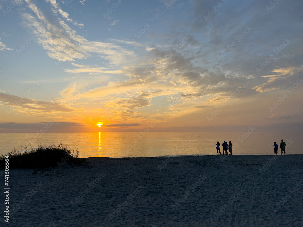 Desolate Turtle Beach on Florida's Gulf coast right before a beautiful blue and orange sunset sunset