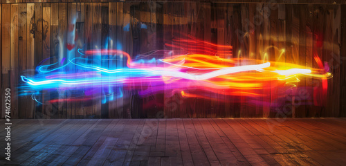 Colourful neon light streaks on a wooden texture in a flowing abstract pattern.