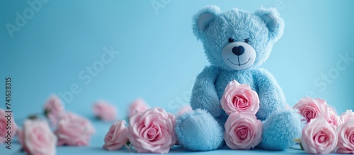 blue teddy bear with pink r...