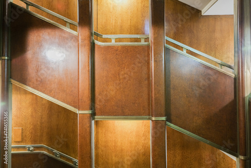 Mahagony wood paneled stairs and staircase in Art Deco style interior design architecture onboard ocean liner cruiseship cruiseship photo