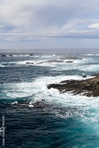 Waves splashing along the rocky California ocean coastline