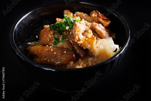 Grilled Chicken teriyaki rice Japanese food isolated in black background