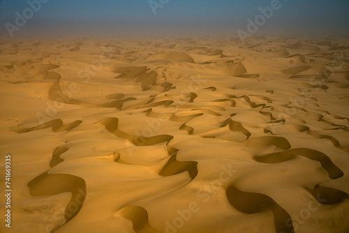 Aerial view of yellow sand dunes in the Namib Desert, Namibia.