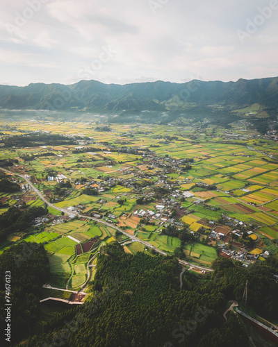 Aerial shot of the village and rice fields of Minamiaso, Kumamoto Prefecture, Kyushu, Japan. photo