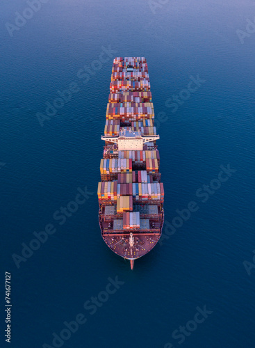 Aerial drone view of Container ship cruising in deep blue sea, Adriatic sea, Izola, Slovenia.