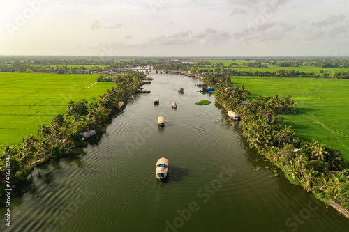 Aerial view of boats sailing the river water in Alappuzha, Kerala, India. photo