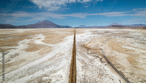 Aerial drone view of train tracks on Uyuni desert, the biggest salt desert in the world, Uyuni, Bolivia. photo