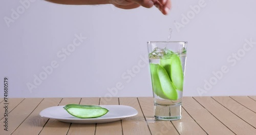  video of aloe vera being cut and chopped on wooden chopping board and washed in water