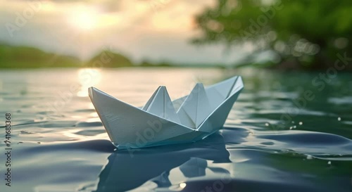 toy paper boat on the river footage photo