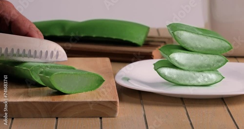 video of aloe vera being cut and chopped on chopping board