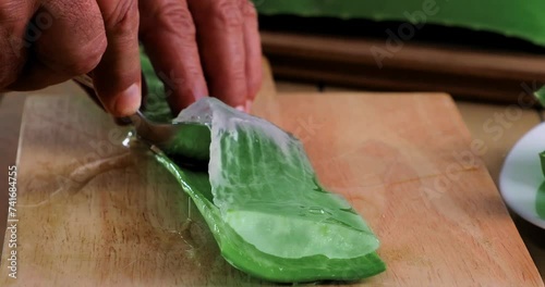 video of aloe vera being cut and chopped on chopping board