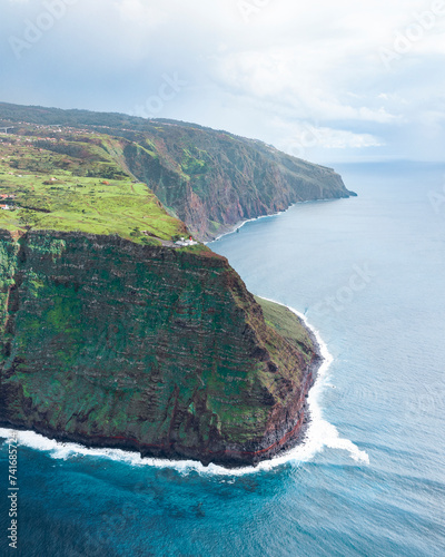 Aerial drone view of Madeira coastline, lighthouse and cliffs from Ponta do Pargo, furthest south end of Madeira island, Portugal. photo