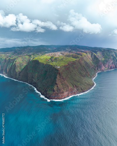 Aerial drone view of Madeira coastline, lighthouse and cliffs from Ponta do Pargo, furthest south end of Madeira island, Portugal. photo