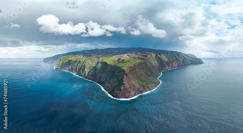 Aerial drone view of Madeira coastline, lighthouse and cliffs from Ponta do Pargo, panorama of the furthest south end of Madeira island, Portugal. photo