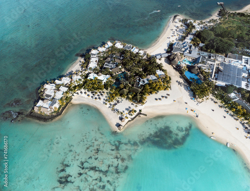 Aerial drone view of 5 star resort Shangri - La Le Touessrok with sandy beach, white villas and pool, Ilot Lievres, Flacq, Mauritius. photo