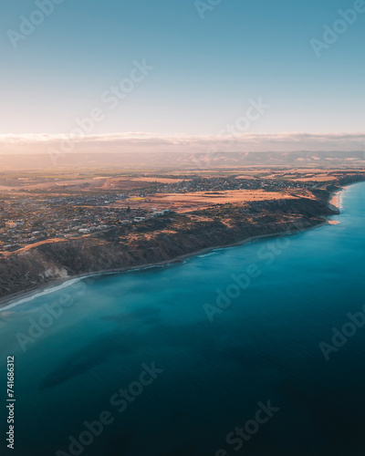 Aerial drone view at sunset of Moana Beach in Fleurieu Peninsula, South Australia, Australia.