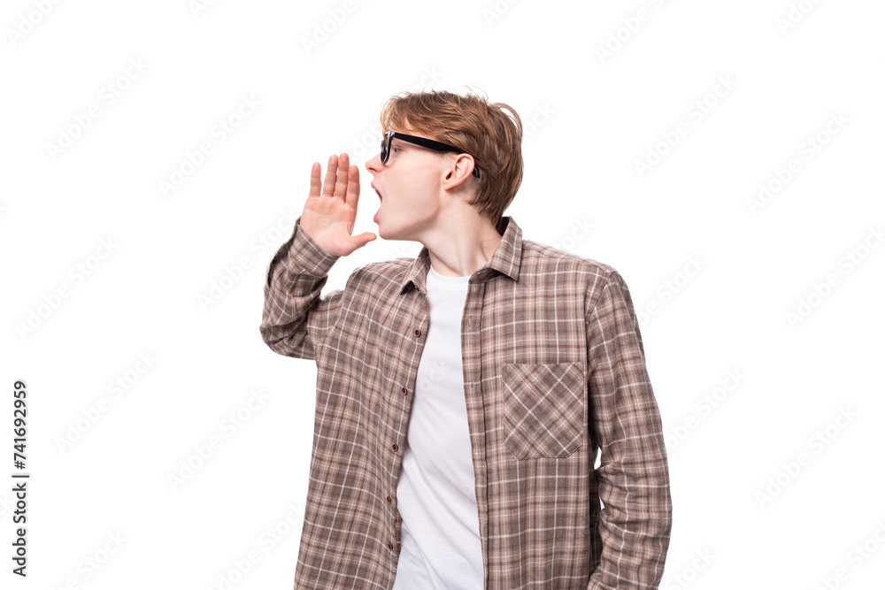 young stylish european student man with golden hair wearing glasses and a plaid shirt young stylish european student man with golden hair wearing glasses and a plaid shirt