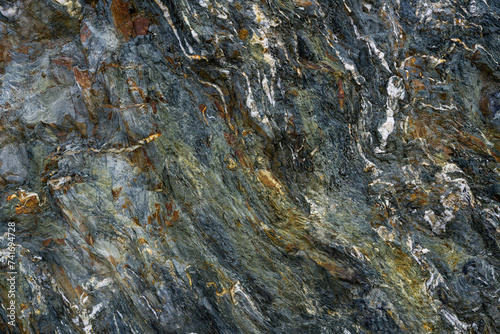 Stone pattern, granite rock surface, colored rock detail texture, rock structures, marble granite deposit.