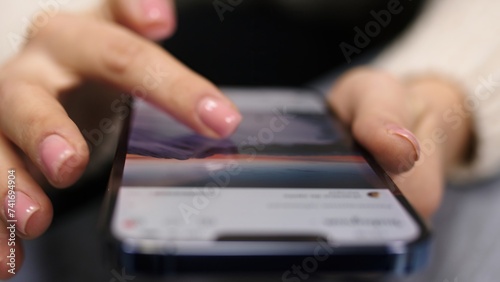 Macro footage of hands scroll through the news feed in social networks. Close up 