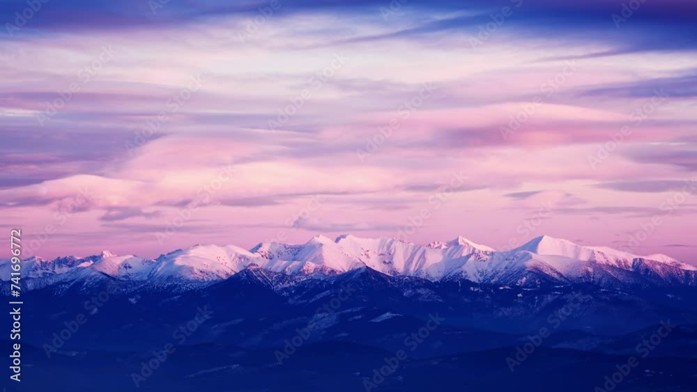 Snow-covered white mountain peaks, pink clouds at dusk, timelapse Snow-covered white mountain peaks, pink clouds at dusk, timelapse