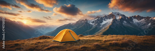 Beautiful early morning camping view. Dolomites sunrise landscape with an orange trekking tent © Sahaidachnyi Roman