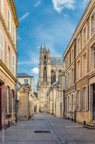 Narrow pedestrian street in old historical city centre, Cathedral Basilica of Our Lady of Amiens Notre-Dame, vertical view, Amiens cityscape, Somme department, Hauts-de-France Region, Northern France
