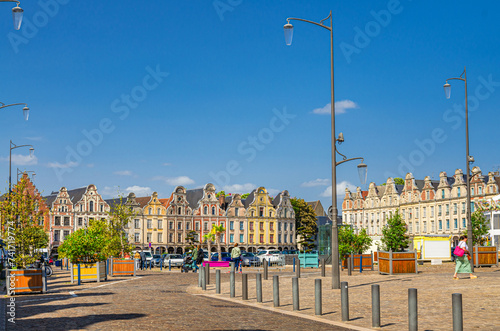 Fototapeta Naklejka Na Ścianę i Meble -  Flemish-Baroque-style townhouses buildings on La Grand Place square in Arras historical city center, blue sky in summer day, Artois, Pas-de-Calais department, Hauts-de-France Region, Northern France