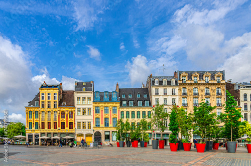 Lille cityscape, Grand Place square in city center, historical monument Flemish mannerist architecture style row of buildings, trees in pots, French Flanders, Hauts-de-France Region, Northern France