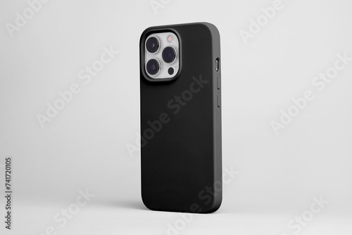 iPhone 15 pro in black case back side view isolated on grey background, smart phone mock up