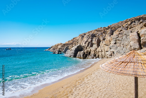 Fototapeta Naklejka Na Ścianę i Meble -  Mikonos, Greece: Agrari Beach with blue sea, wild and quiet, famous for diving, snorkeling and water activity. As most beaches in Mykonos, Agrari Beach is naturism friendly.