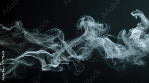Wispy White Smoke Swirling Gracefully on a Black Background in Low-light Conditions